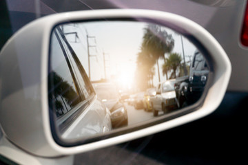 Blurred of car stop on the asphalt road view on mirror.