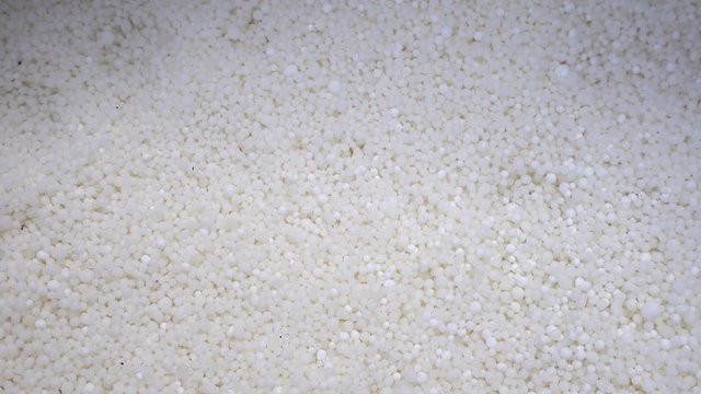 Mineral fertilizer nitrate (saltpeter). Fertilization of plants, soil with nitrogen, phosphorus, potassium fertilizer