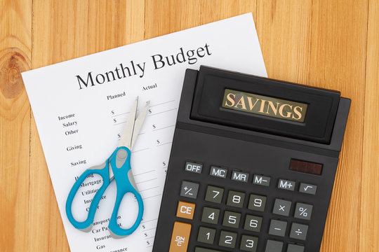 Cutting your monthly budget with a calculator and scissors