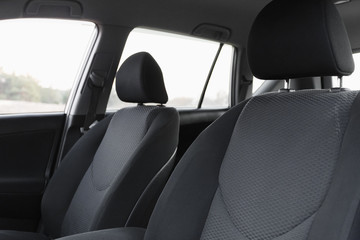 Car interior, part of front seats, close