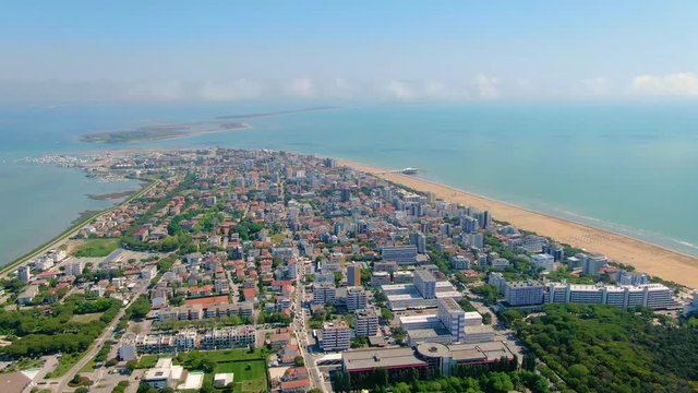 Lignano Sabbiadoro City on Tropical Coastline of Italy, Aerial Drone Shot