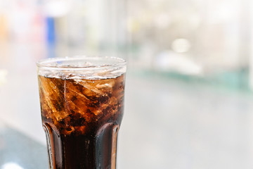 Cola soft drink with Ice ,Cola Glass close-up on abstract blurred restaurang backgrounds