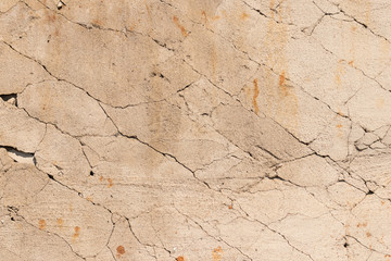 Fototapeta premium Horizontal photo of old cracked terracotta wall