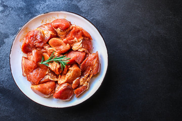 raw meat pork or beef in a plate on the table (preparing healthy food, marinade and spices paprika) menu concept background. top view. copy space