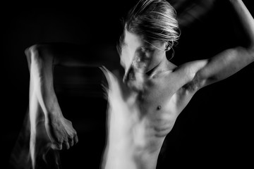 Skinny man raised his hands. visible ribs, bare torso. dark struggle with doubts. abstract conceptual artistic view. representation of subconscious feelings, doubts and thoughts. Landscape orientation