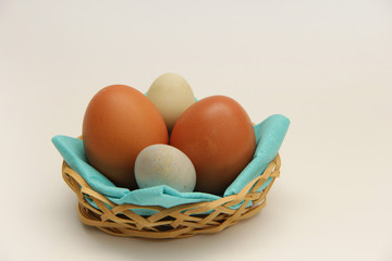 eggs in a basket on white background