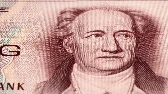 Johann Wolfgang von Goethe portrait on East German 20 mark (1964) banknote tracking. Slider shot. Low angle, macro. 4K