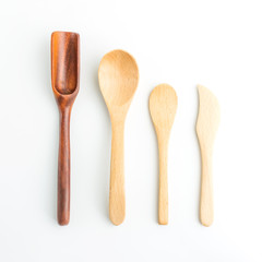 wooden spoons on white in top view