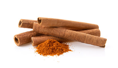 cinnamon sticks stacked on white background