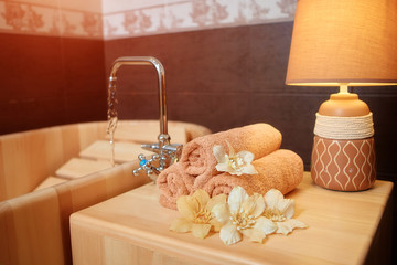Spa treatment in the salon for relieving fatigue in a traditional folk style in a wooden bath with hydro massage