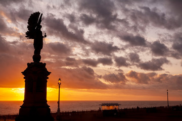 Brighton peace statue at sunset