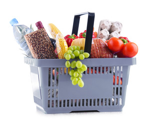 Plastic shopping basket with assorted grocery products