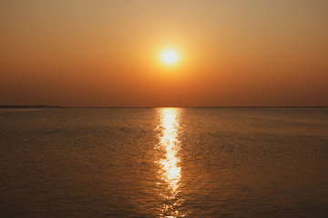 The sunset on the sea in the summer