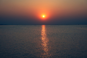 The sunset on the sea in the summer