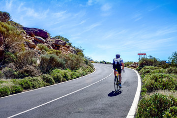 cyclist on the roads crossing the beautiful desert landscape on the island of Tenerife