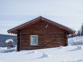 Alpine style wooden chalet. Hotel in the ski resort Gornaya Salanga. Winter day