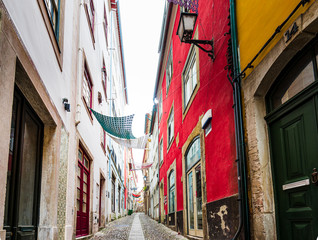 Fototapeta na wymiar View on ancient houses in old town of Coimbra, Portugal