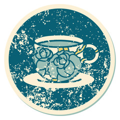 distressed sticker tattoo style icon of a cup and flowers