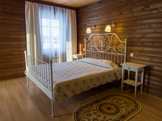 Hotel room in the hotel of the ski resort Gornaya Salanga. Beautiful stylish alpine style room