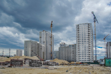 Tower cranes and formwork for the construction of a residential building