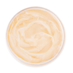 Jar of yellow cream isolated on white background