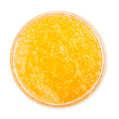 Jar of orange cream isolated on white background