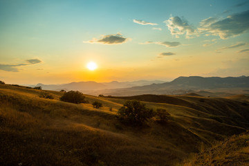 Fototapeta na wymiar Beautiful View On Sunrise Or Sunset On Cape Meganom In Summer In Crimea, Russia.