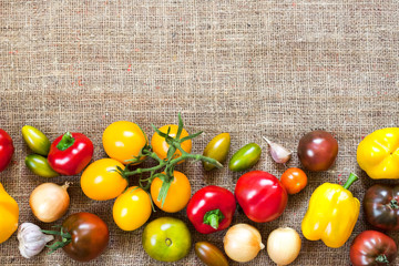 Assortment of colorful fresh vegetables on sackcloth background