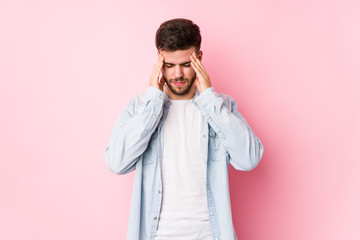 Young caucasian business man posing in a white background isolated touching temples and having headache.< mixto >