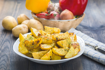 Plate with roasted potatoes