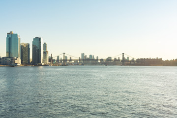 Fototapeta na wymiar Williamsburg Bridge connecting Manhattan to Brooklyn New York over the East River before Sunset