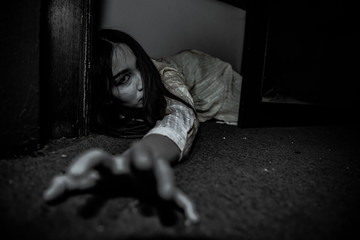 Portrait of asian woman make up ghost face with blood,Horror scene,Scary background,Halloween...