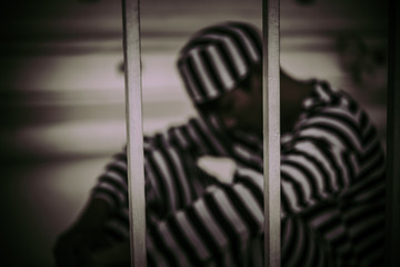 Portrait of man desperate to catch the iron prison,prisoner concept,thailand people,Hope to be...