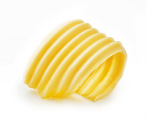 Butter curl or butter roll isolated on white background - obrazy, fototapety, plakaty