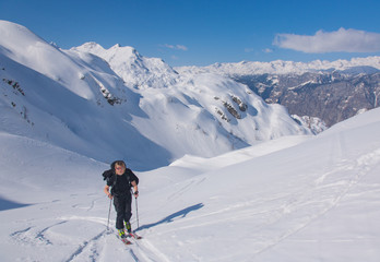 Fototapeta na wymiar Woman ski touring