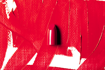 Beautiful photo of red lipstick, texture of red lipstick on a white background close-up.