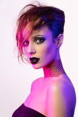 Colorful portrait of a sensual young woman in avant garde style