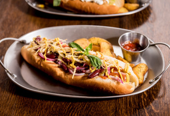 Hotdogs and French fries on a dishes. Fast food meal. Restaurant.