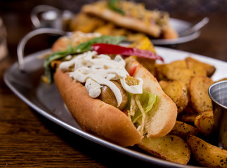 Hotdogs and French fries on a dishes. Fast food meal. Restaurant.