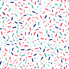 Fototapeta na wymiar Colorful sprinkles seamless repeat vector pattern for wrapping paper,prints,fabrics.
