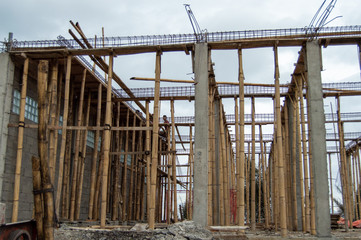 Bamboo pole scaffolding on building construction site
