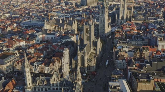 Ghent Belgium Aerial v2 Birdseye view flying low around downtown area with cityscape views at sunset - November 2019