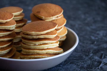 Stacks of pancakes on a gray background