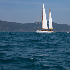 Fototapeta premium Landscape of tropical island with moving boat.