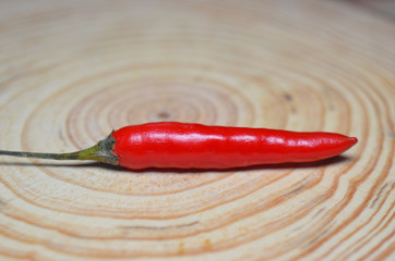 Small red pepper on the indoor chopping board