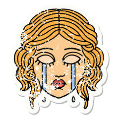 traditional distressed sticker tattoo of female face crying