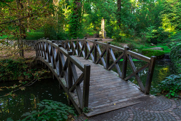 park in Uman city, old wooden bridge over the pond