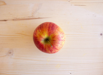 red tasty Sicilian apples on the on the wooden background, top view. Healthy lifestyle, vitamins and Mediterranean diet.