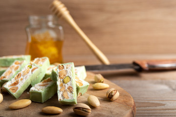 Homemade pistachio nougat on a dark rustic background