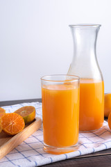 fresh squeezed orange juice on wood table